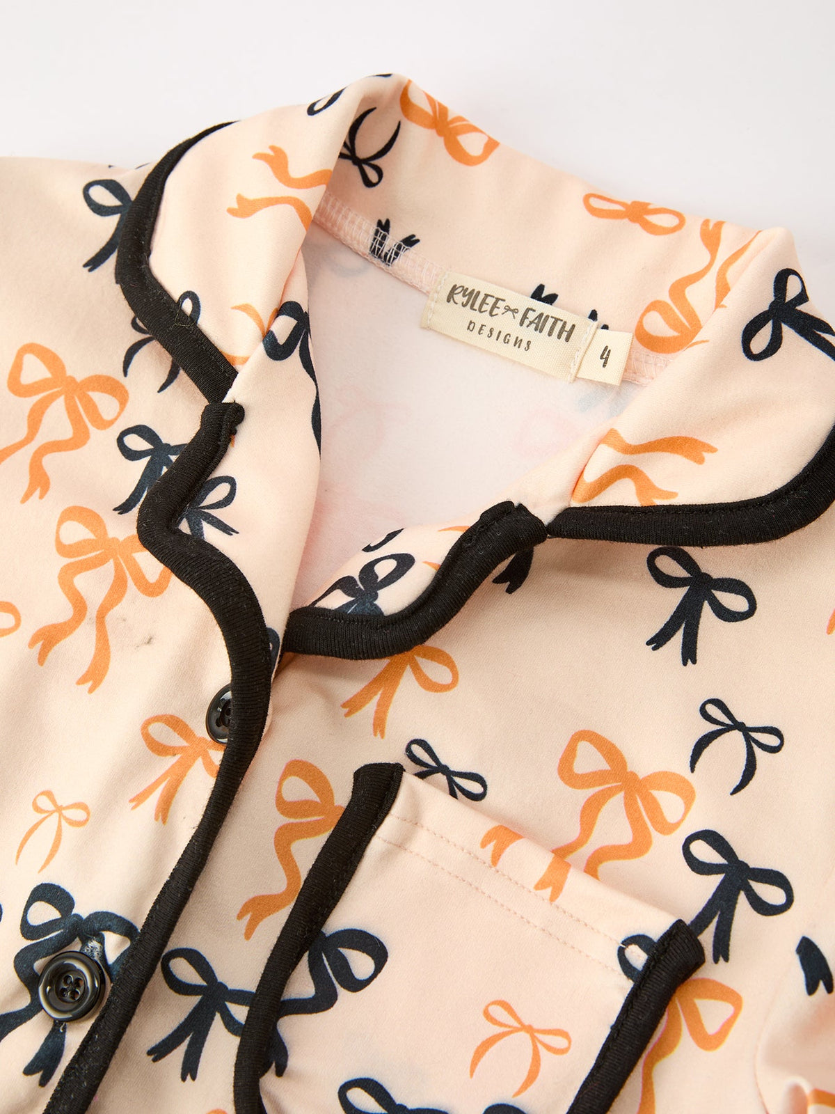 Girls Halloween Pajama Set – Bow Print Long Sleeve Top & Ruffle Shorts